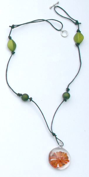 Beading: black cord, orange flower pendant and green necklace