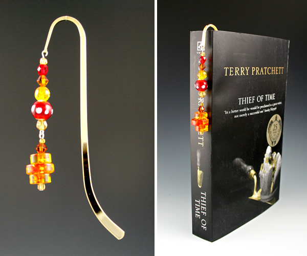 Gold-tone bookmark #15, amber, red, and yellow, with amber drop