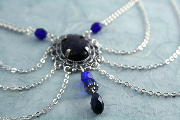 Starry blue decollette necklace, closeup, md