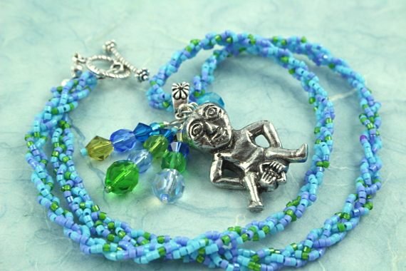Sheela-na-gig necklace - blue and green, circle, md